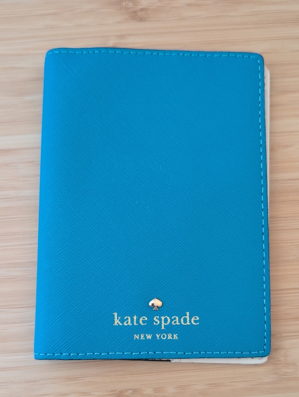 kate spade teal passport cover with gold logo